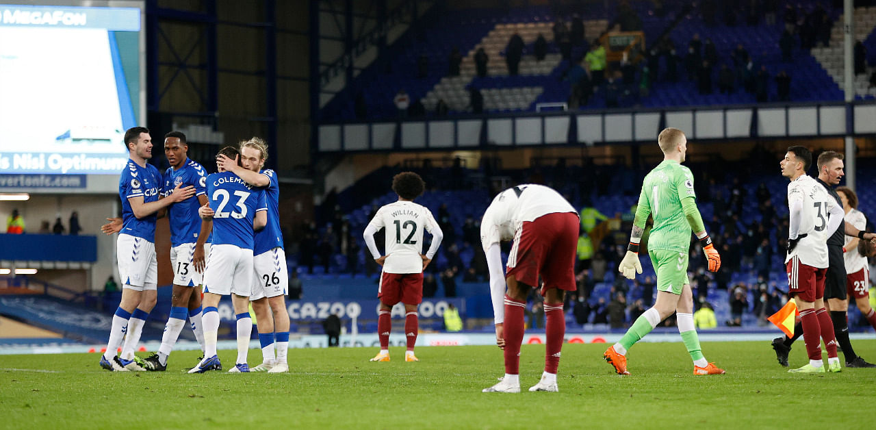  Everton players celebrate while Arsenal players look dejected after the match. Credit: Reuters Photo