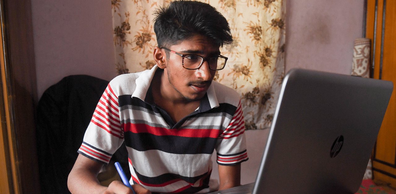 A 10th standerd student attends online revision class, with his school teachers, for the up coming SSLC Board exam, in Bengaluru on Monday. Credit: DH File Photo/BH Shivakumar