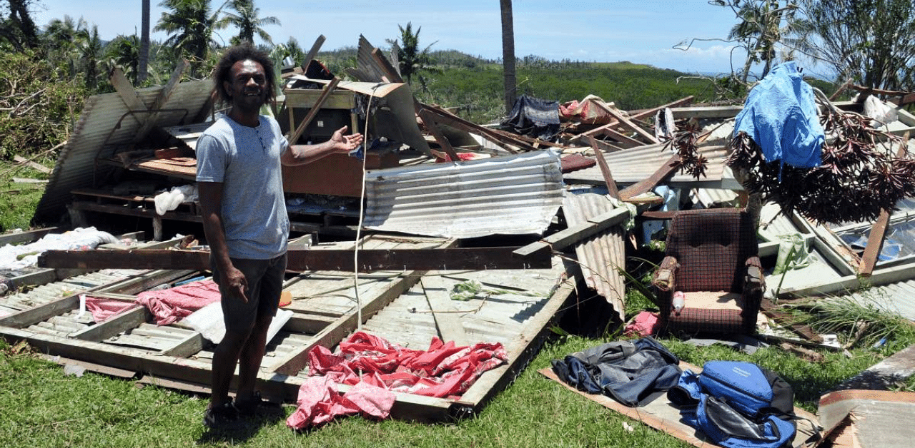 A resident standing in front of his destroyed house in the aftermath of Cyclone Yasa in northern Bua on Vanua Levu Island of Fiji. Credit: AFP