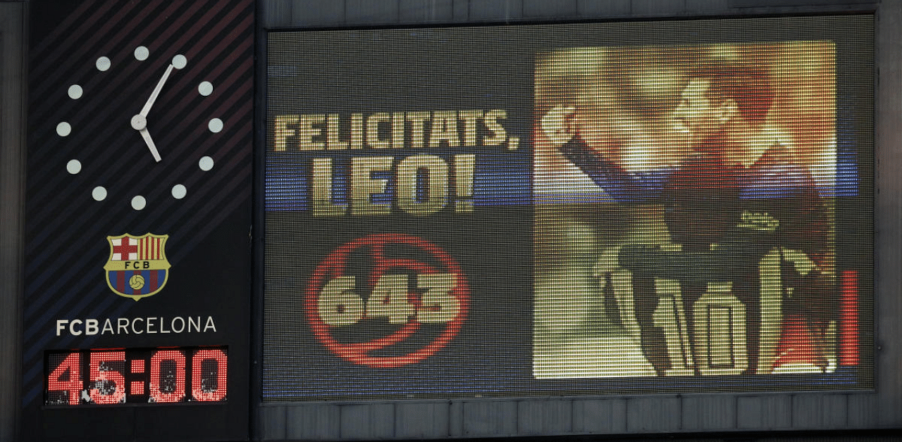 Big screen showing Barcelona's Lionel Messi scoring 643 goals equaling Pele's record for most goals at one club. Credit: Reuters