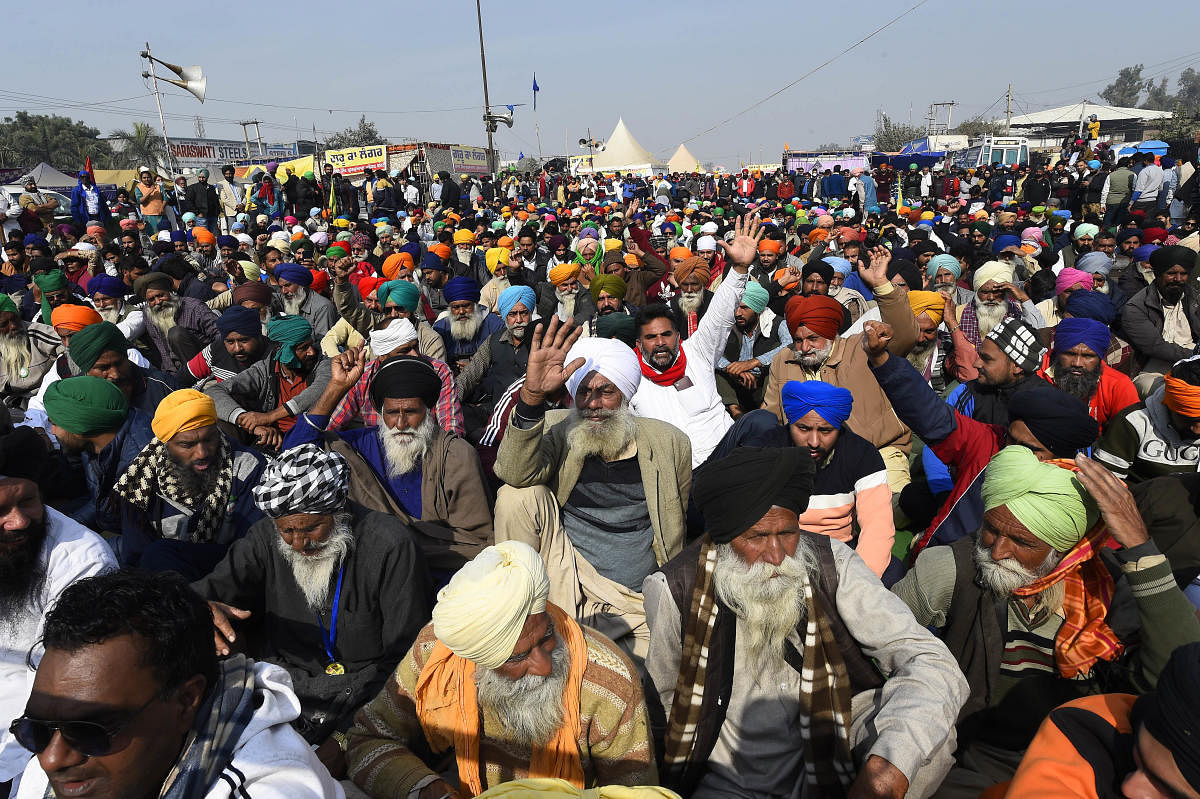 Farmers gather at Singhu border during their 'Delhi Chalo' protest march against the centre's new farm laws, in New Delhi. Credit: PTI