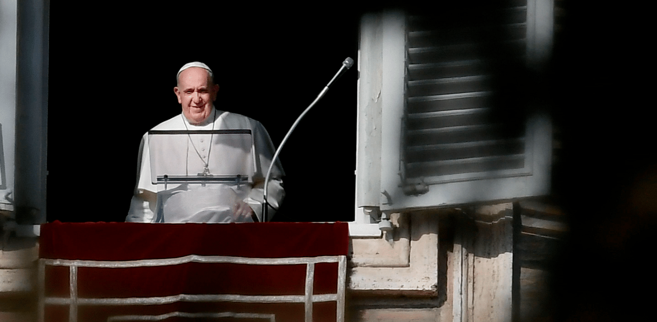 Pope Francis addresses worshippers from the window of the apostolic palace overlooking St. Peter's Square during the weekly Angelus prayer on December 20, 2020. Credit: Reuters