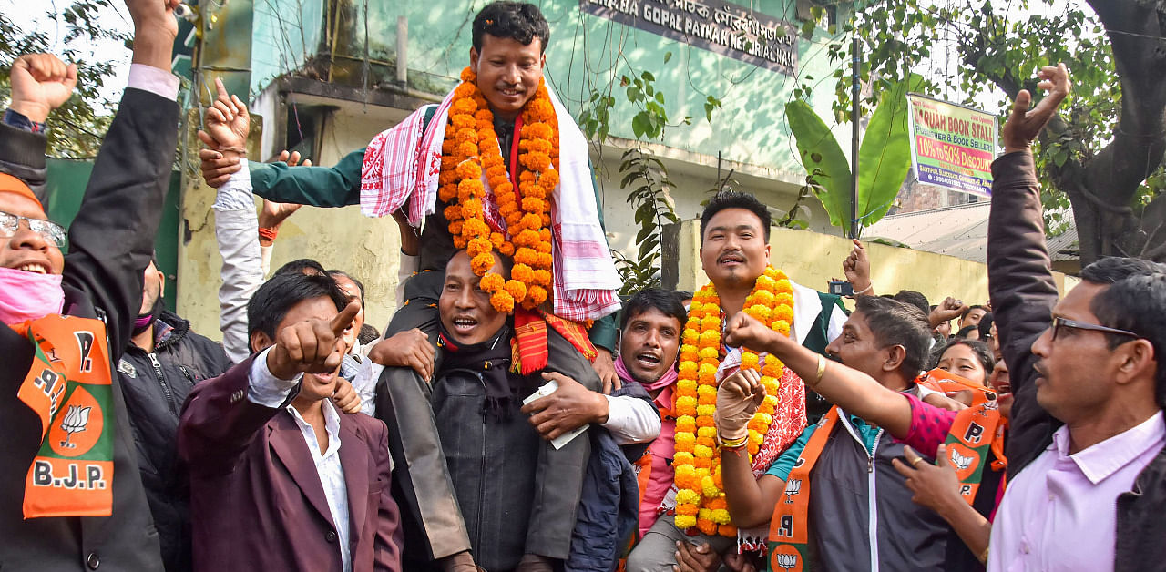 BJP leaders and supporters celebrate their victory during counting day of Tiwa Autonomous Council (TAC) elections, in Guwahati. Credit: PTI Photo