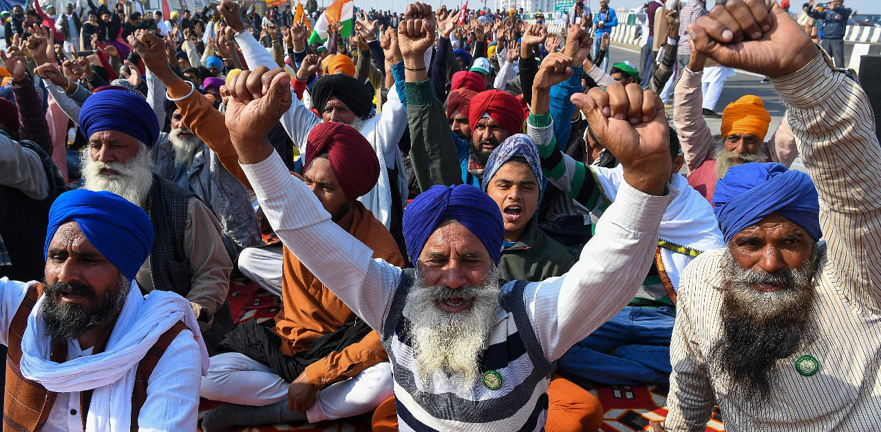 Farmers shout slogans during a protest against the central governments recent agricultural reforms at the Delhi-Uttar Pradesh state border, in Ghazipur. Credit: AFP Photo