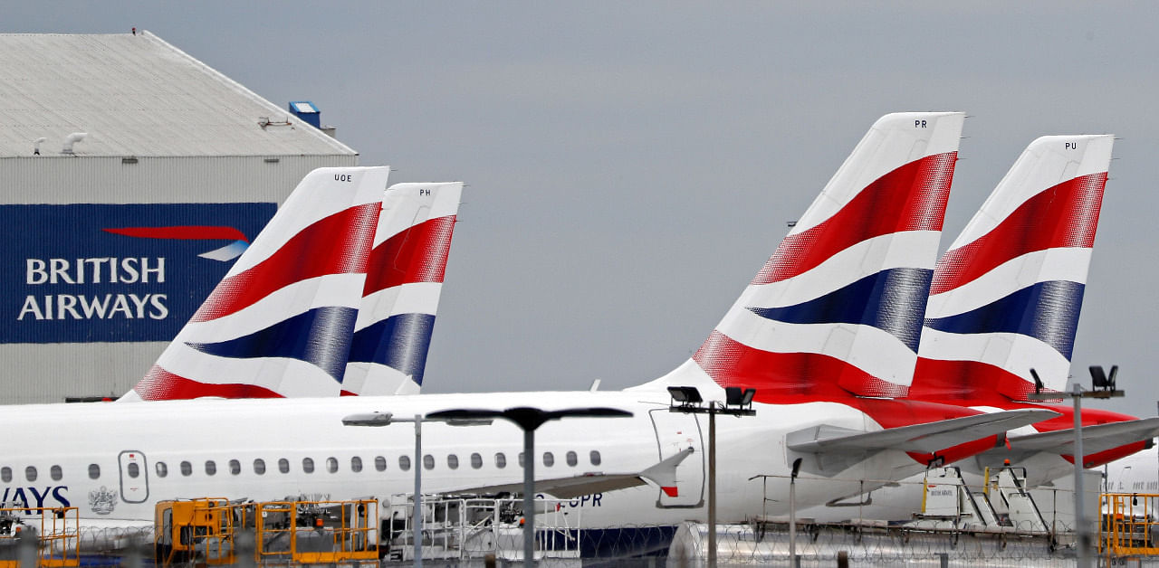 British Airways passenger planes are pictured at the apron at London Heathrow Airport in west London. Credit: AFP Photo