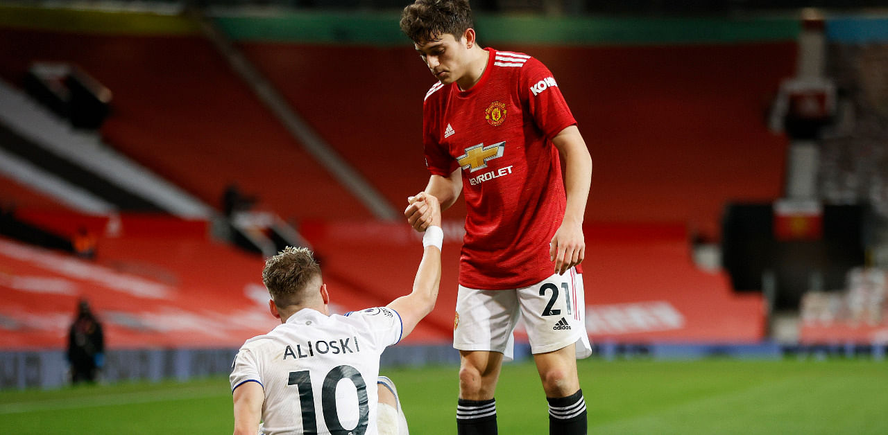 Manchester United's Daniel James and Leeds United's Ezgjan Alioski after the match. Credit: Reuters Photo