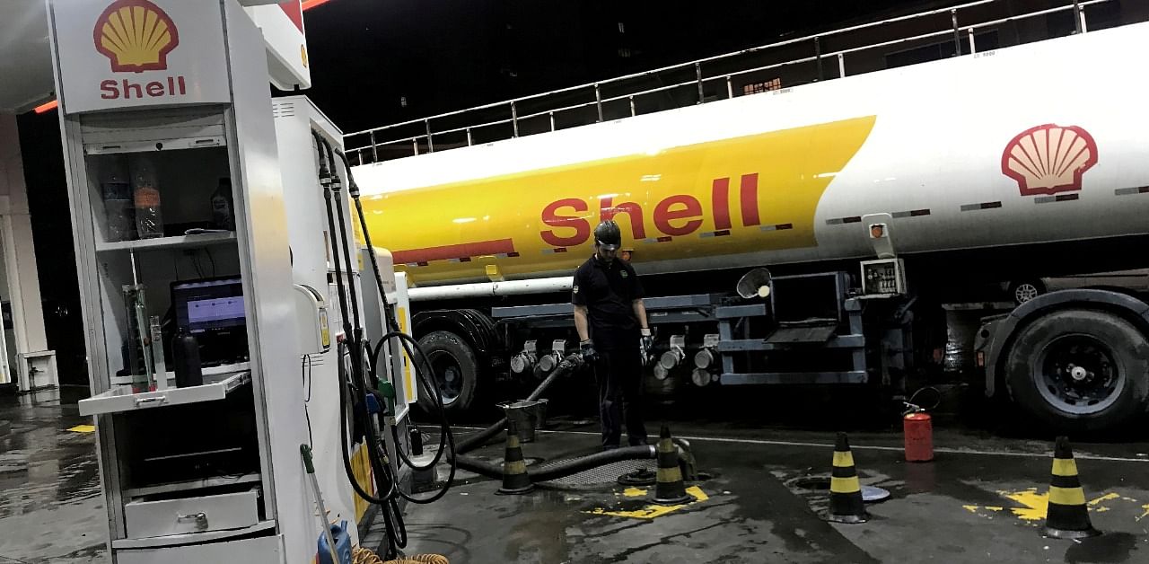 An oil tank truck fills the pumps at a Shell petrol station in Sao Paulo, Brazil. Credit: Reuters Photo