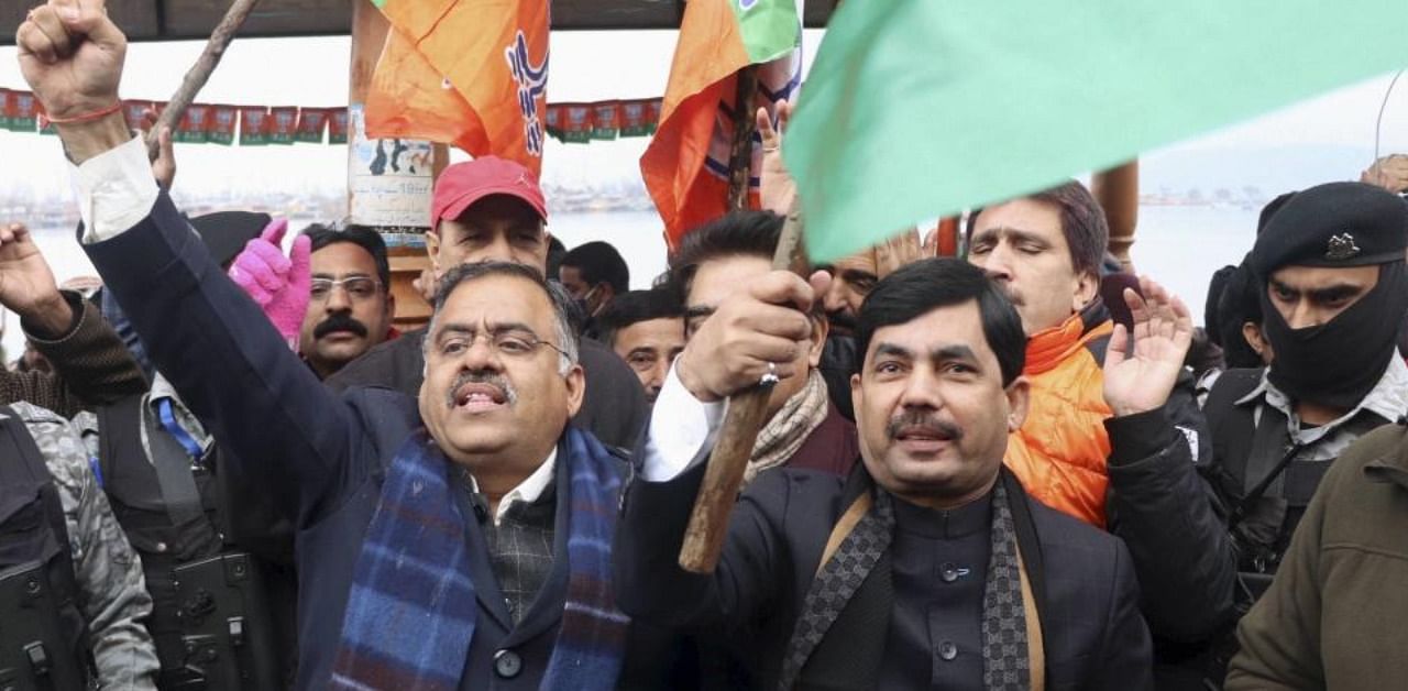 BJP leader Syed Shahnawaz Hussain during an election rally for District Development Council polls, near Dal Lake in Srinagar. Credit: PTI Photo