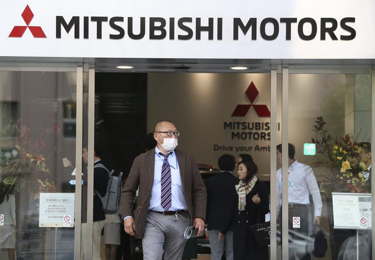  People visit a showroom at the headquarters of Mitsubishi Motors Corp in Tokyo. Credit: AP file photo. 