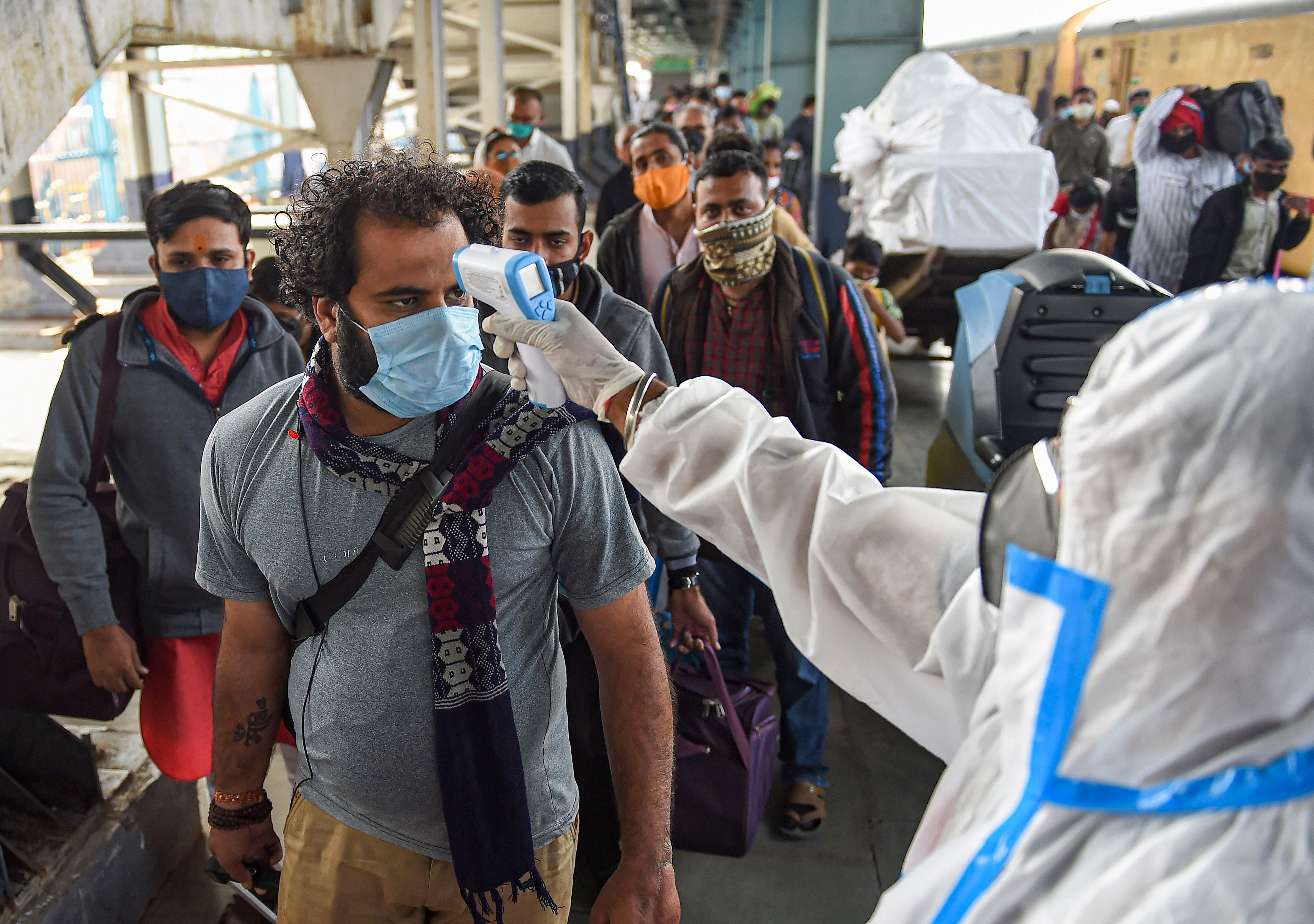 Passengers undergo thermal screening, amid coronavirus. Credit: PTI Photo