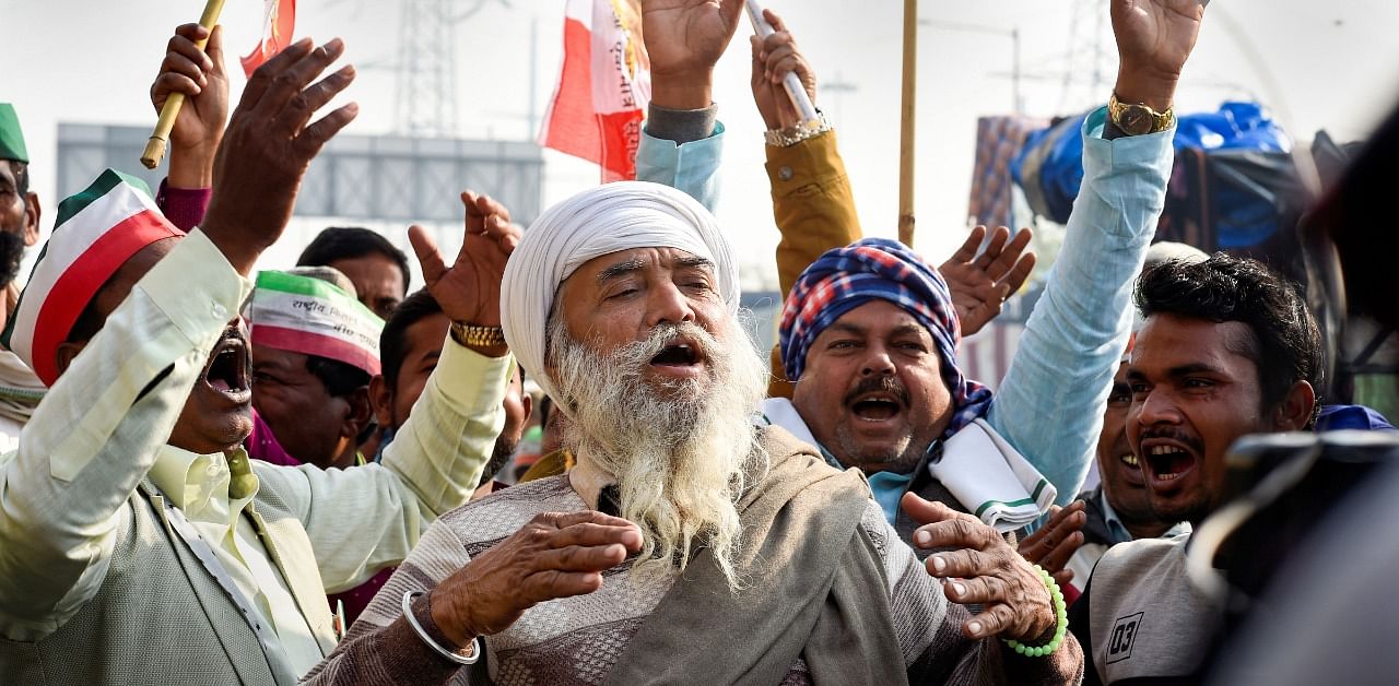 Bharatiya Kisan Union (BKU) members during a protest against the Center's new farm laws at Ghazipur border in New Delhi. Credit: PTI Photo
