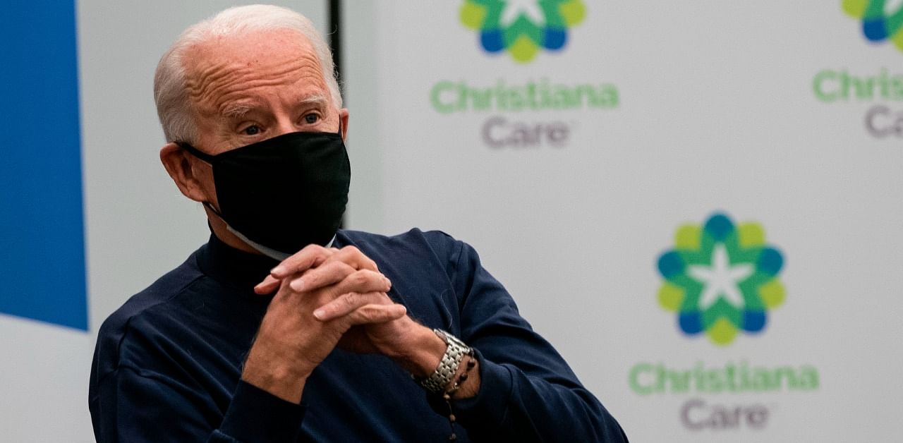 US President-elect Joe Biden reacts after he recieved a Covid-19 vaccination at the Christiana Care campus in Newark, Delaware. Credit: AFP Photo