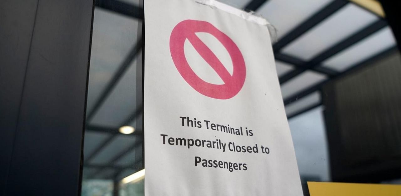 A sign alerts travels to the closure of Terminal 3 at Heathrow Airport in west London on December 21, 2020, as a string of countries around the world banned travellers arriving from the UK. Credit: AFP.