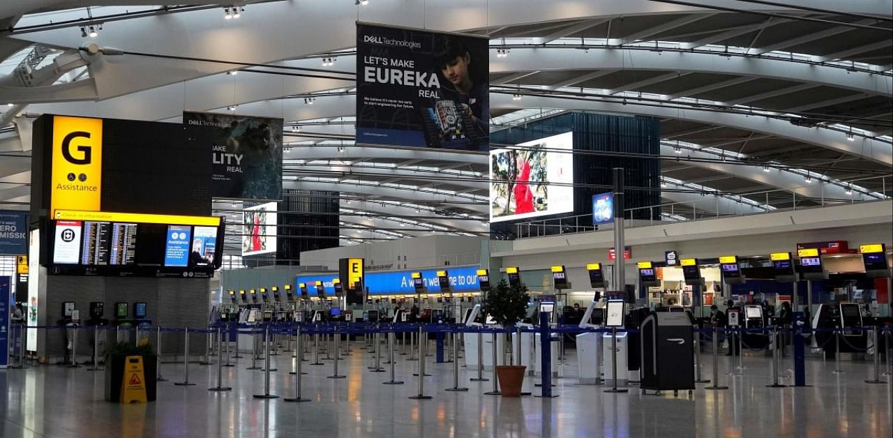 The almost deserted departures hall is pictured in Terminal 5 at Heathrow Airport in west London on December 21, 2020, as a string of countries around the world banned travellers arriving from the UK, due to the rapid spread of a new, more-infectious coronavirus strain. Credit: AFP.