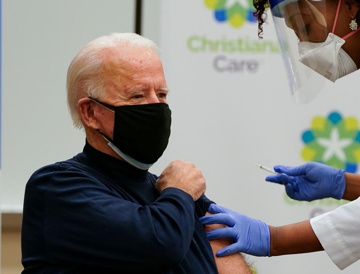 US President-elect Joe Biden receives a Covid-19 vaccination from Tabe Mase, Nurse Practitioner and Head of Employee Health Services, at the Christiana Care campus in Newark, Delaware. Credit: AFP