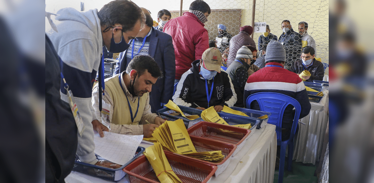 Counting of votes for the recently concluded District Development Council elections in progress at a centre, in Jammu, Tuesday, Dec. 22, 2020.  Credit: PTI Photo