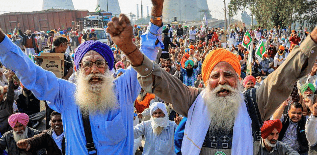  Bharatiya Kisan Union (BKU) activists block NH-15 in support of the nationwide strike, called by farmers to press for repeal of the Centre's Agri laws, in Bathinda, Tuesday, Dec. 8, 2020. Credit: PTI Photo