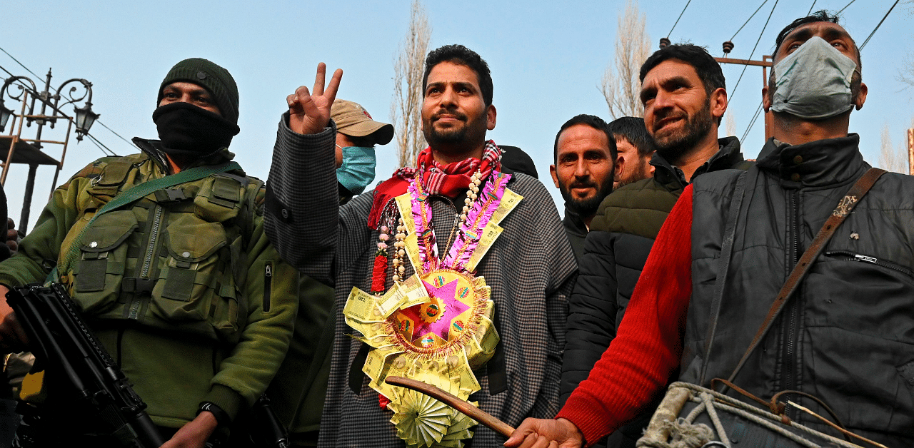 Aijaz Hussain, the Bharatiya Janata Party candidate for the District Development Council (DDC) polls celebrates after he won a DDC seat outside a counting centre in Srinagar on December 22. Credit: AFP
