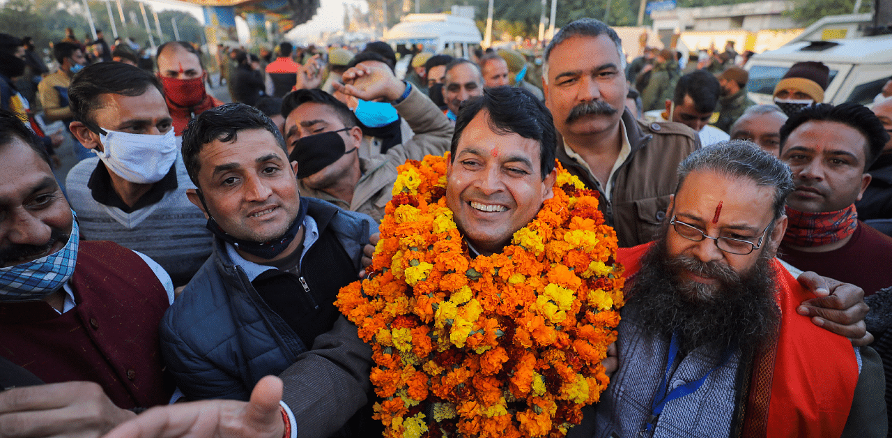 BJP candidate Suresh Kumar flashes victory sign after his lead in the District Development Council (DDC) election results in Jammu. Credit: PTI