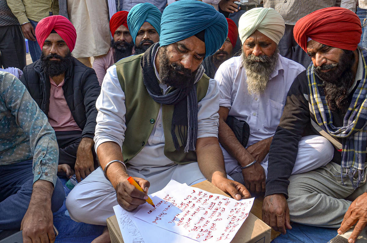 Farmers during their protest against the new farm laws, at Ghazipur Border in New Delhi, Wednesday, Dec. 23, 2020. Credit: PTI Photo