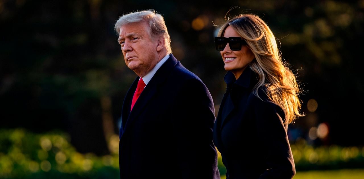 President Donald Trump and First Lady Melania Trump walk towards Marine One as they depart the White House en route to Mar-a-Lago, the President's private club, where they will spend Christmas and New Years Eve in Washington. Credit: AFP Photo