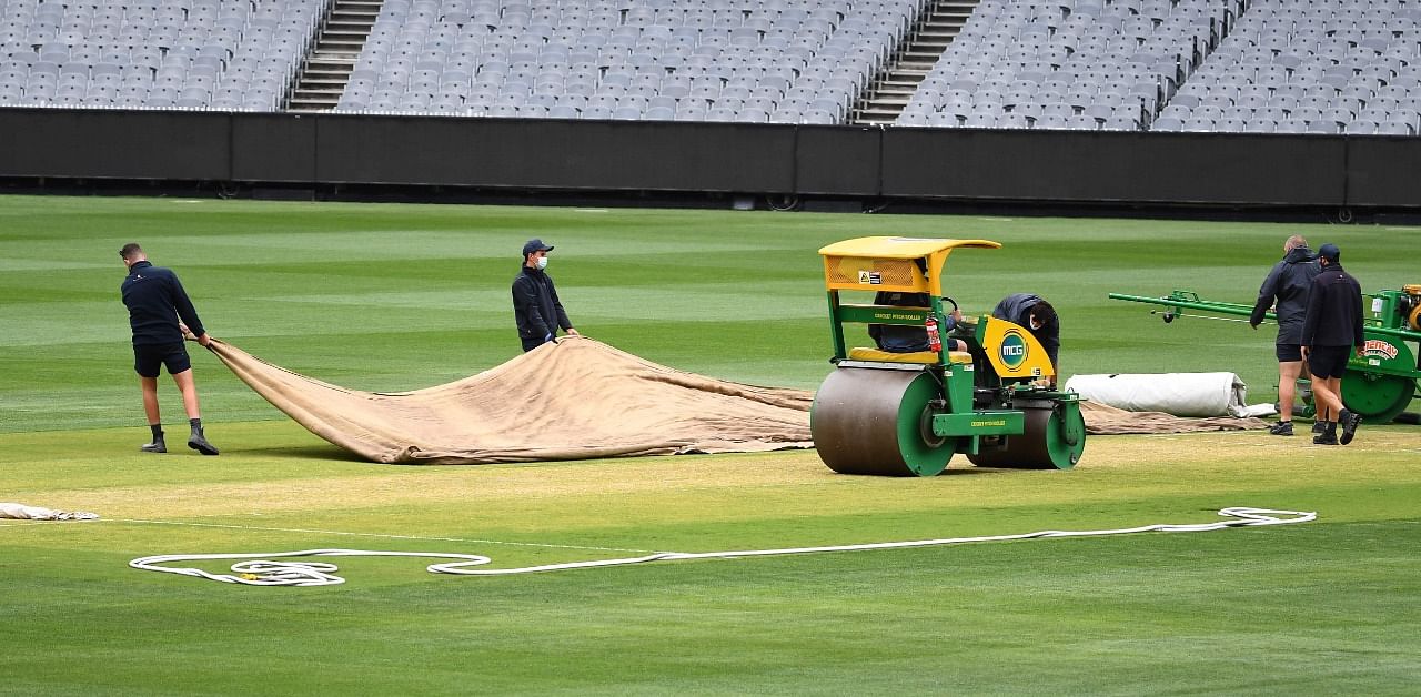 Groundsmen prepare the wicket at the MCG ahead of the second cricket Test match against India, in Melbourne on December 24, 2020. Credit: AFP Photo