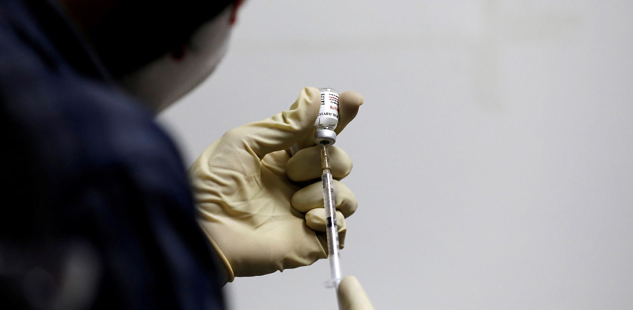 A medic fills a syringe with COVAXIN, an experimental Covid-19 vaccine. Credit: Reuters Photo