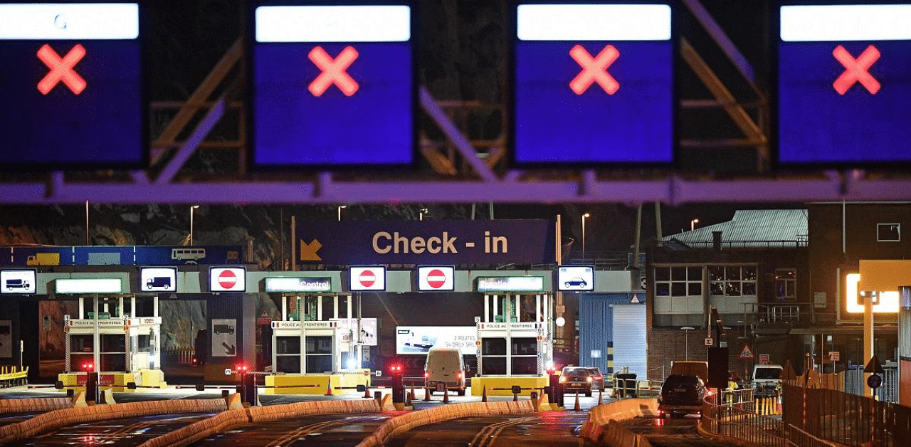 Vehicles start to pass through the check-in booths at the ferry terminal at the Port of Dover, in Dover in Kent, south east England, after the Covid-19 testing of drivers queueing to depart for Europe got underway. Credit: AFP