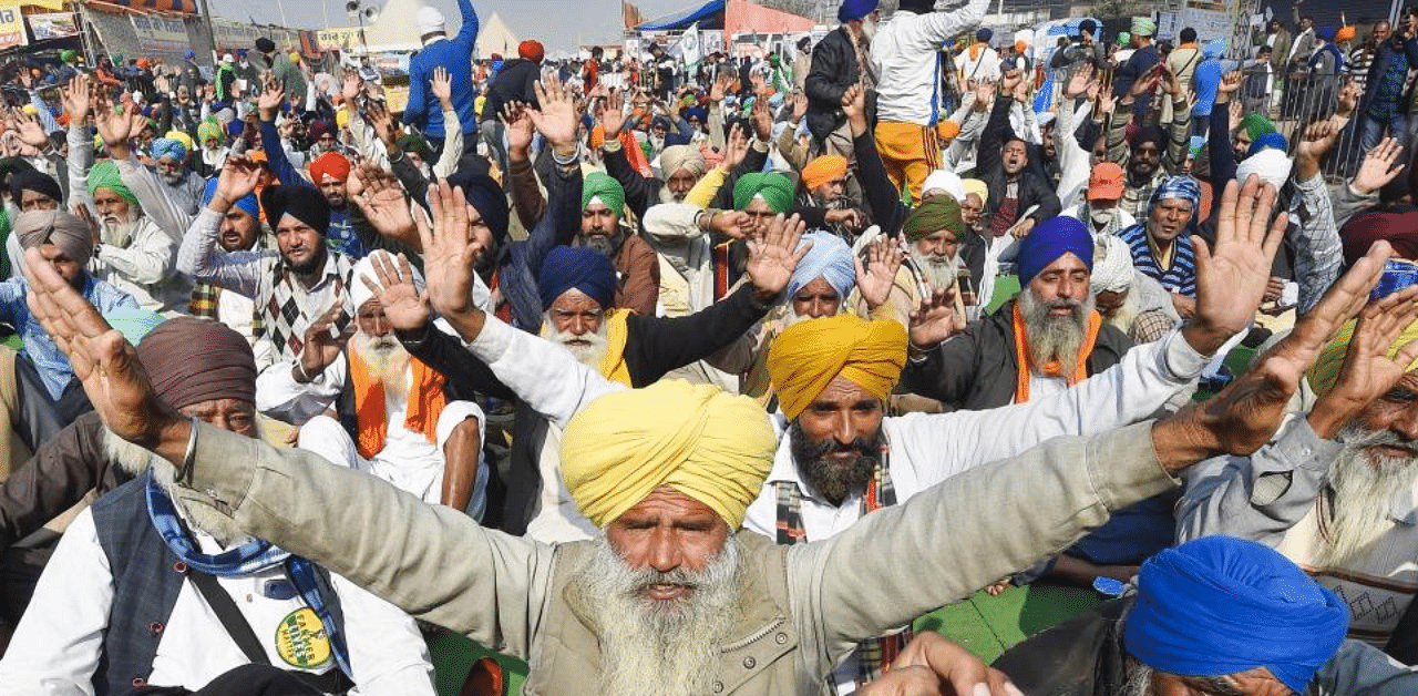 Farmers shout slogans at Singhu border during their 'Delhi Chalo' protest march against the Centre's new farm laws, in New Delhi, Wednesday, Dec. 23, 2020. Credit: PTI Photo