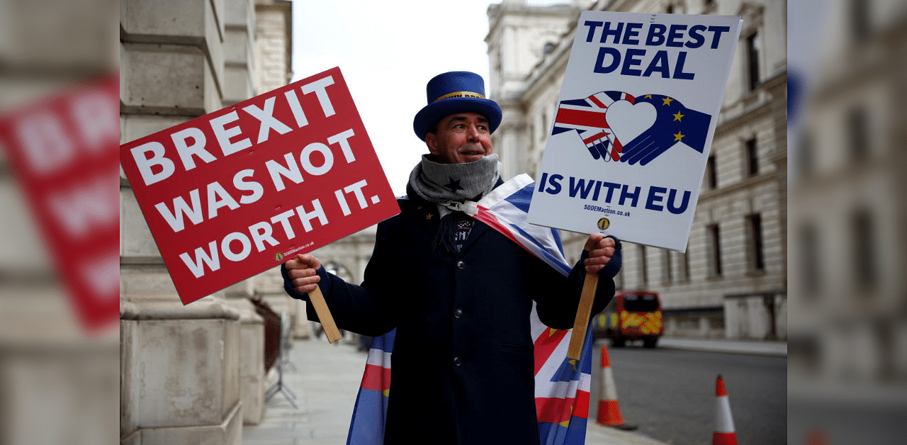 Anti-Brexit protester Steve Bray holds signs outside Foreign and Commonwealth Office (FCO) in London. Credit: Reuters Photo