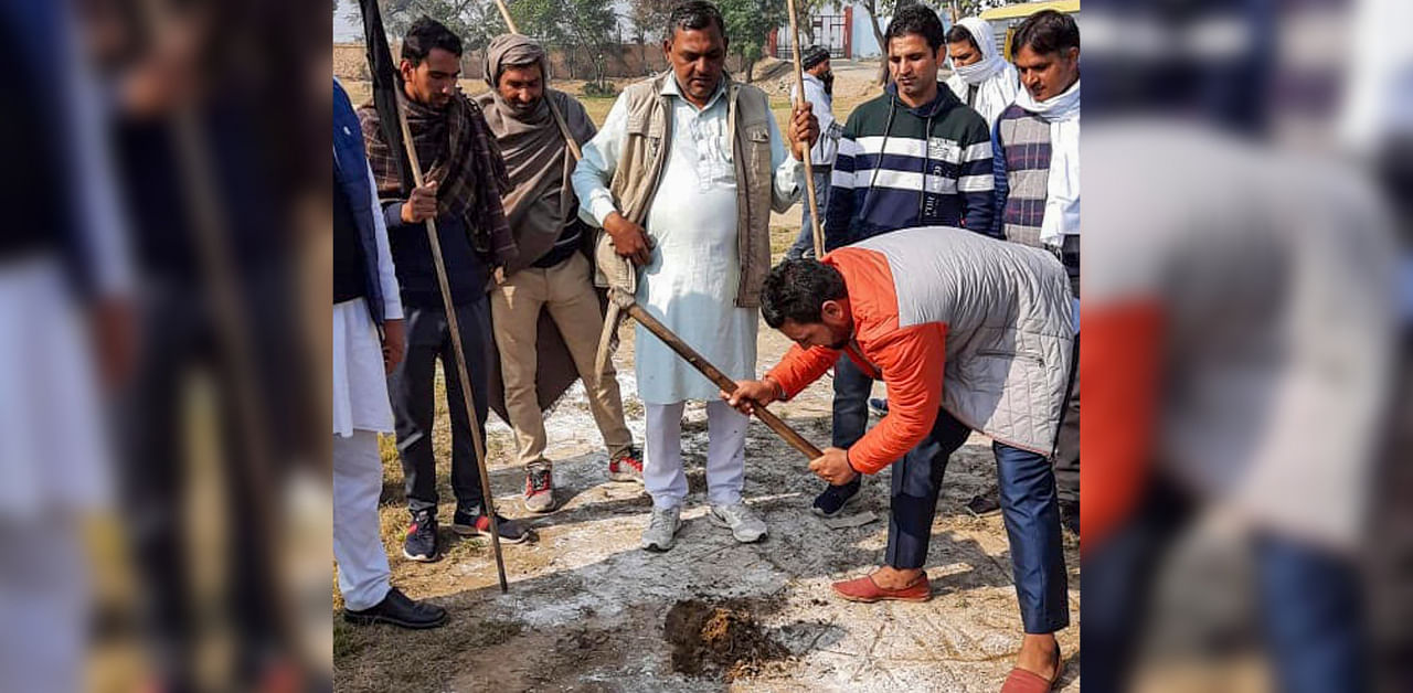 Agitated farmers dig up a helipad before the arrival of Haryana Deputy CM Dushyant Chautala in Jind district, Thursday, Dec. 24, 2020. Credit: PTI Photo