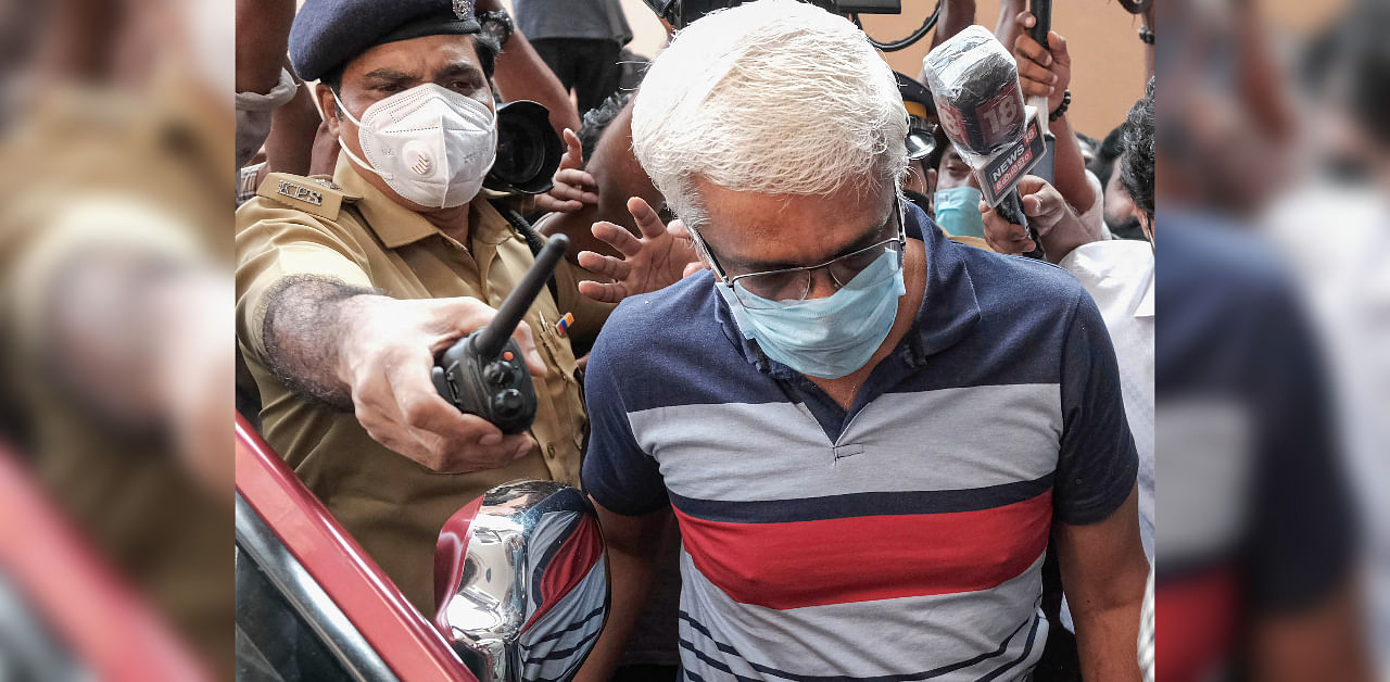 Suspended IAS officer M Sivasankar being taken into custody by Enforcement Directorate (ED) for questioning in connection to the Kerala gold smuggling case, in Kochi, Wednesday, Oct. 28, 2020. Credit: PTI File Photo