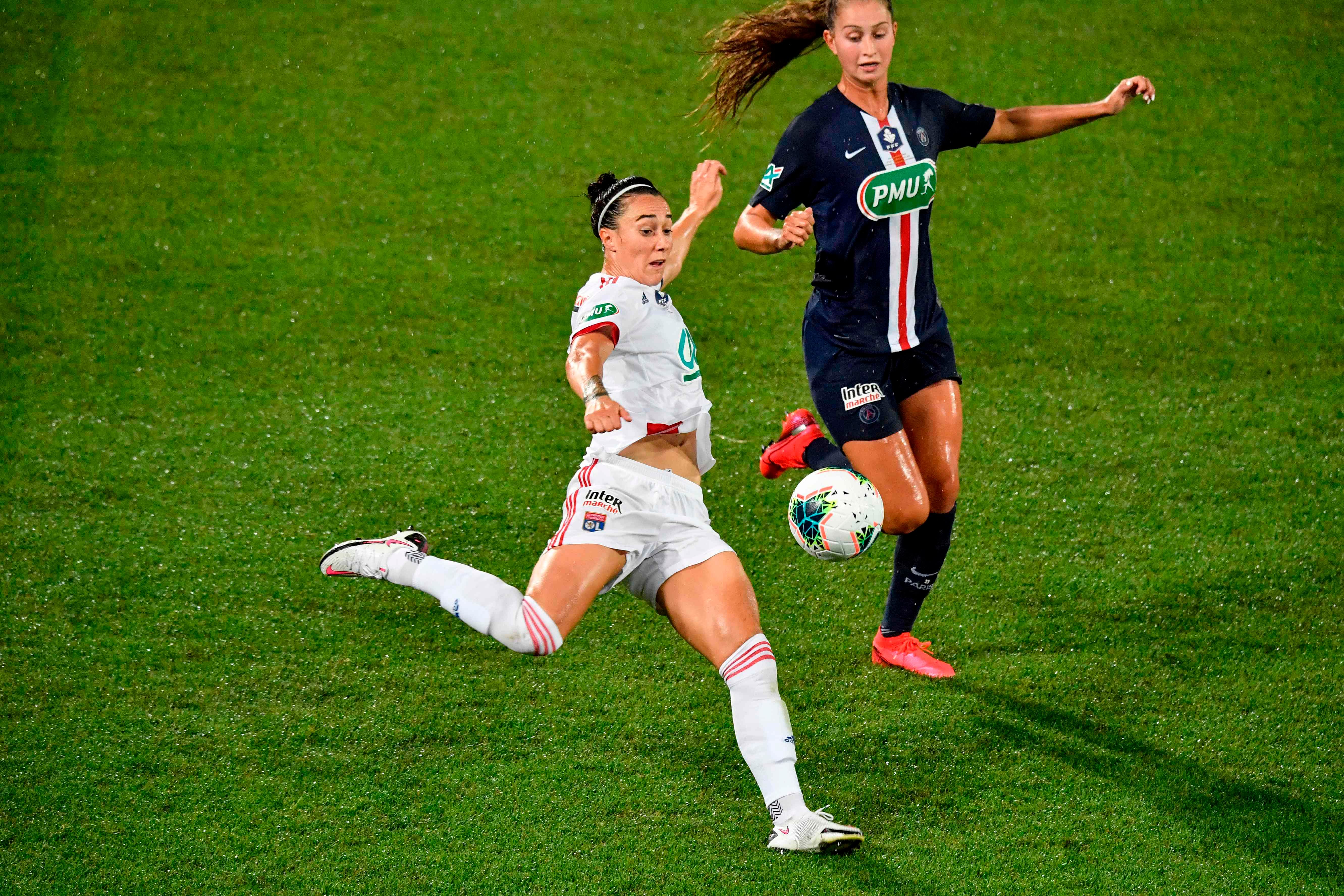 This file photo taken on August 9, 2020 shows Olympique Lyonnais's British defender Lucy Bronze (C) kicking the ball next to Paris Saint-Germain's Canadian forward Jordyn Huitema (R) during the French Cup final football match between Olympique Lyonnais (OL) and Paris Saint-Germain (PSG) at the Abbe-Deschamps stadium in Auxerre. - England defender Lucy Bronze was named best women's player of the year during FIFA's 'The Best' awards ceremony on December 17, 2020, succeeding last year's winner Megan Rapinoe. The 29-year-old Manchester City defender, who won the Champions League with Lyon in August, carried off the award ahead of her former Lyon teammate Wendie Renard, and striker Pernille Harder, who moved from Wolfsburg to Chelsea in early September. Credit: AFP File Photo