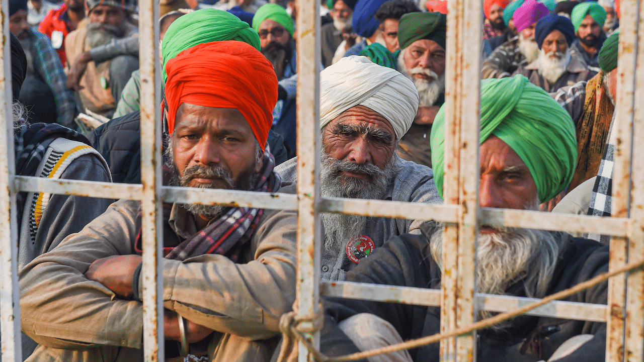 Farmers during a protest against the new farm laws, at Singhu Border in New Delhi. Credit: PTI Photo