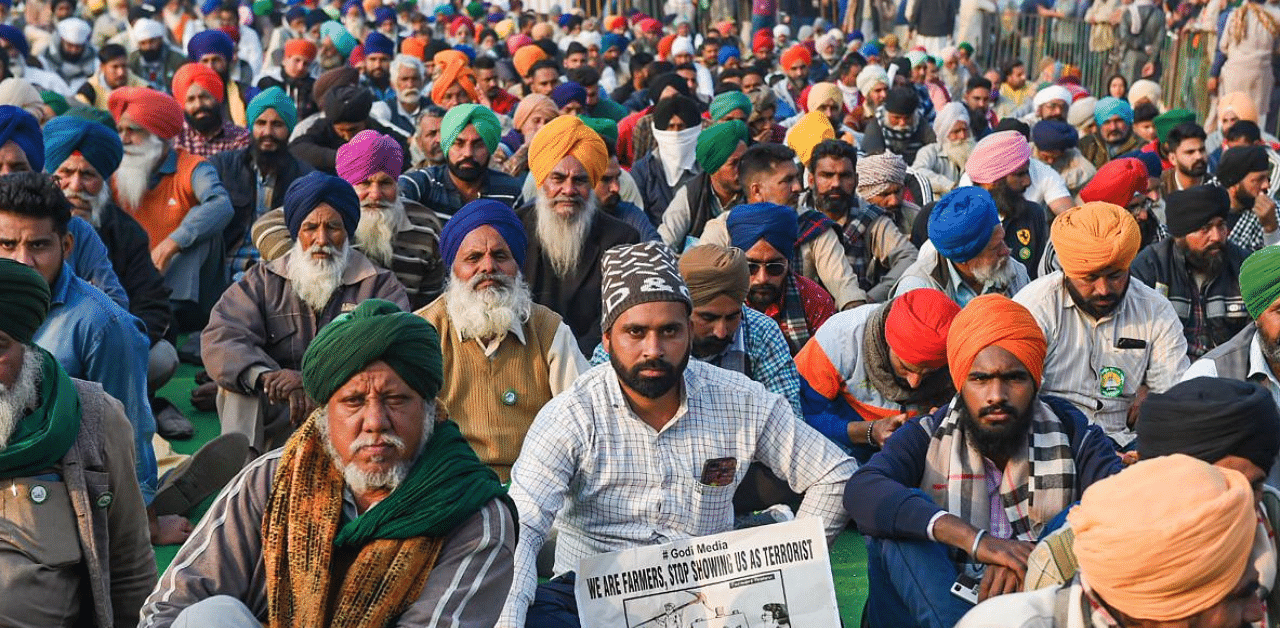 Farmers during their protest against the Center's new farm laws, at Singhu Border in New Delhi. Credit: PTI Photo