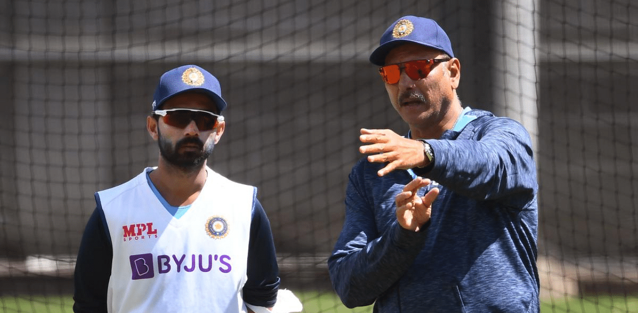 India's captain Ajinkya Rahane (L) chats with coach Ravi Shastri (R) during a training session ahead of the second cricket Test match against Australia, in Melbourne. Credit: AFP