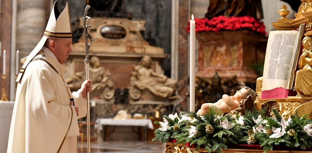 Pope Francis celebrates Christmas Eve mass with only a few faithful able to participate due to the coronavirus disease. Credit: Reuters Photo