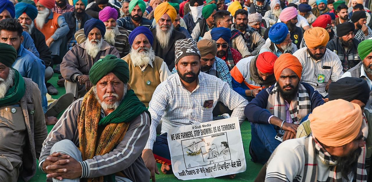 Farmers during their protest against the Center's new farm laws, at Singhu Border in New Delhi. Credit: PTI Photo