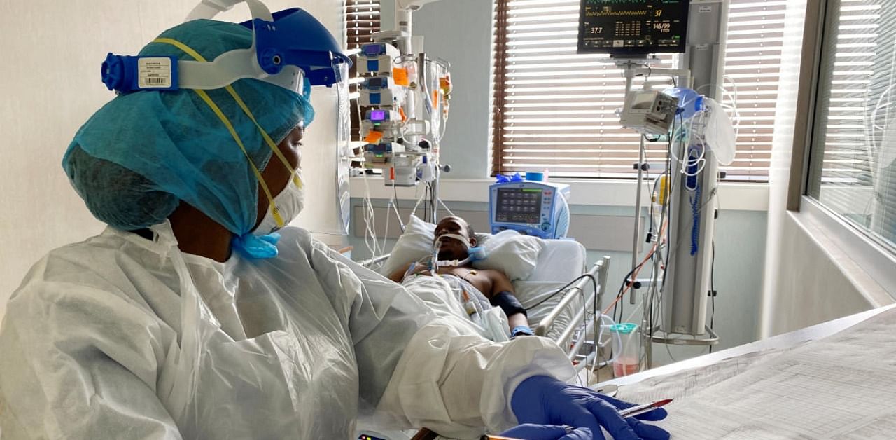 A medical staff attends to a Covid-19 patient at a special ward at Arwyp Medical Centre, as South Africa is about the reach a milestone of 1 million infections, in Kempton Park. Credit: Reuters.