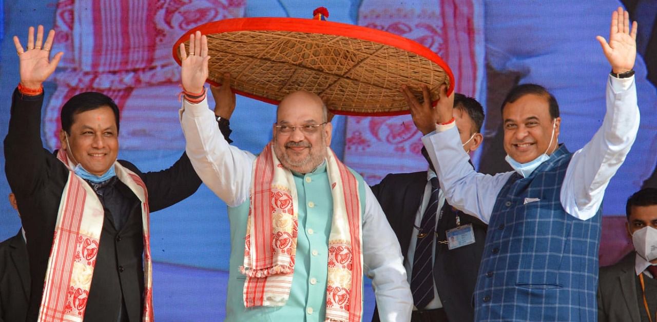 Union Home Minister Amit Shah felicitated by Assam Chief Minister Sarbananda Sonowal and Assam Finance Minister Himanta Biswa Sarmah during the ceremonial program for 'Assam Darshan', at Amingaon in Kamrup district. Credit: PTI.