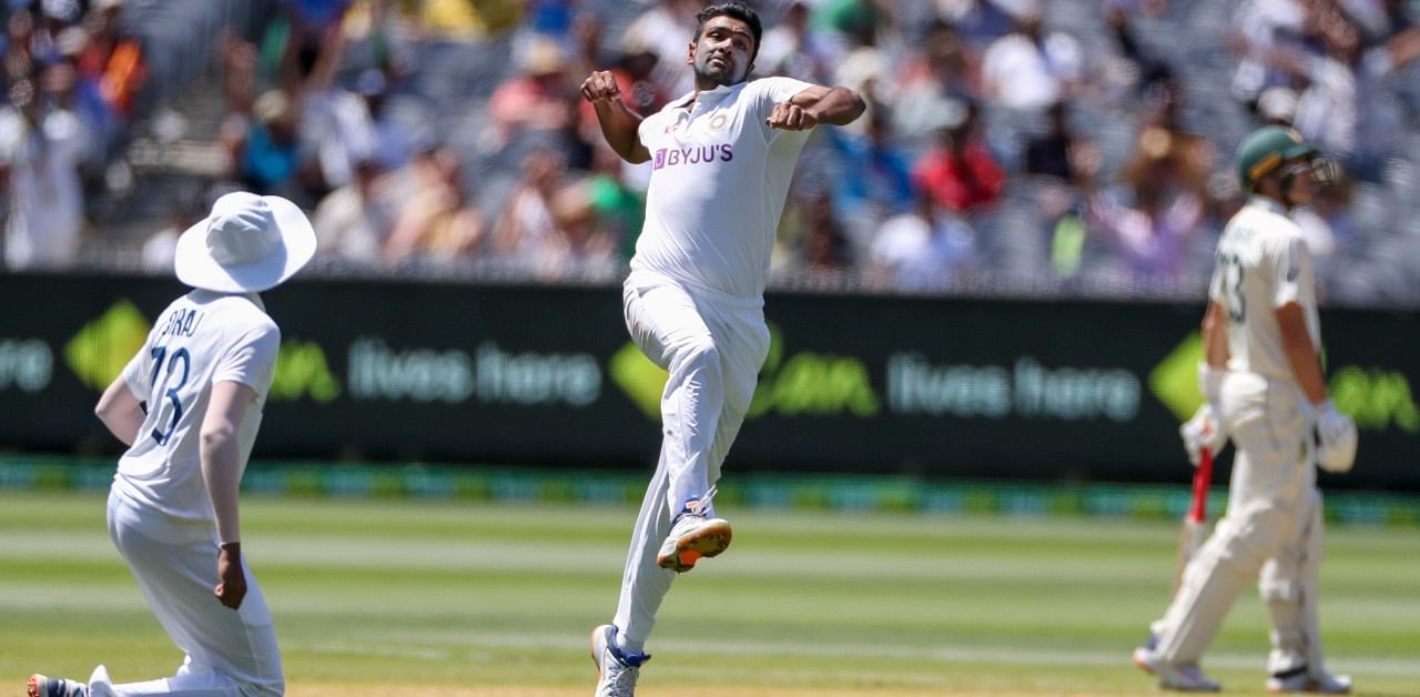India's Ravichandran Ashwin celebrates after taking the wicket of Australia's Steve Smith for no score during play on day one of the Boxing Day cricket test between India and Australia at the Melbourne Cricket Ground, Melbourne. Credit: AP/PTI Photo