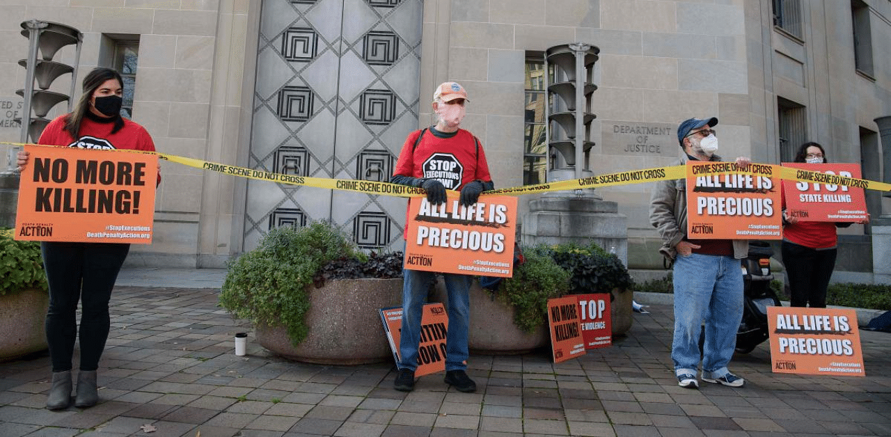 Demonstrators protest federal executions of death row inmates, in front of the US Justice Department in Washington, DC. Credit: AFP File Photo