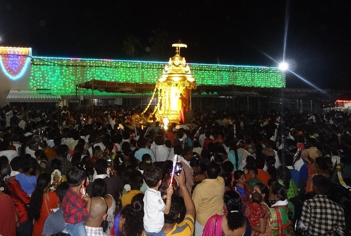 Devotees gather at the Male Mahadeshwara temple, during the golden chariot procession, held every evening.