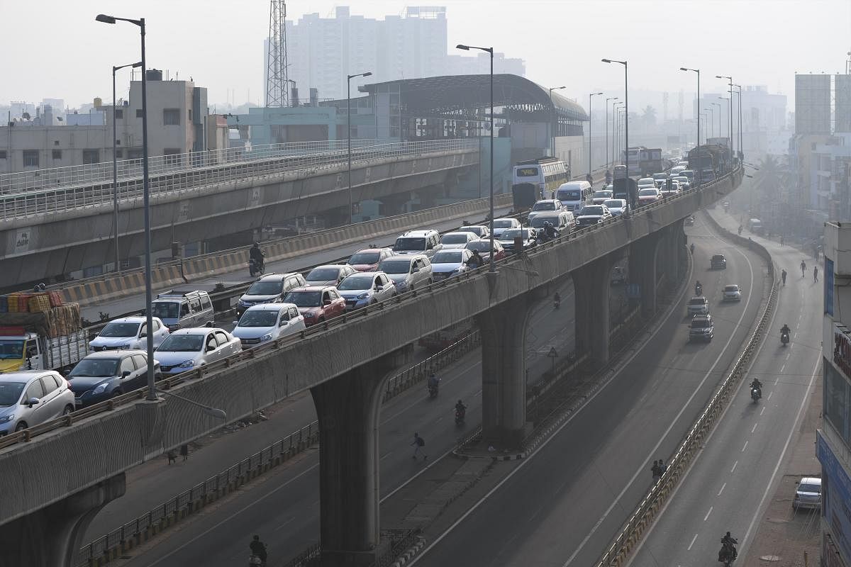 Exit gates of toll plazas in the north and south of the city witnessed traffic snarls that stretched nearly a kilometre during morning and evening peak hours. Credit: DH Photo