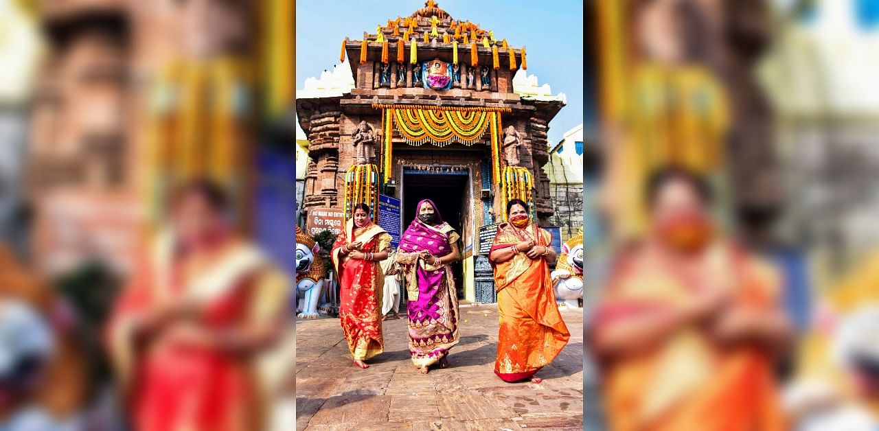 Devotees visit Jagannath Temple after it reopened for visitors, amid the coronavirus pandemic, in Puri. Credit: PTI.
