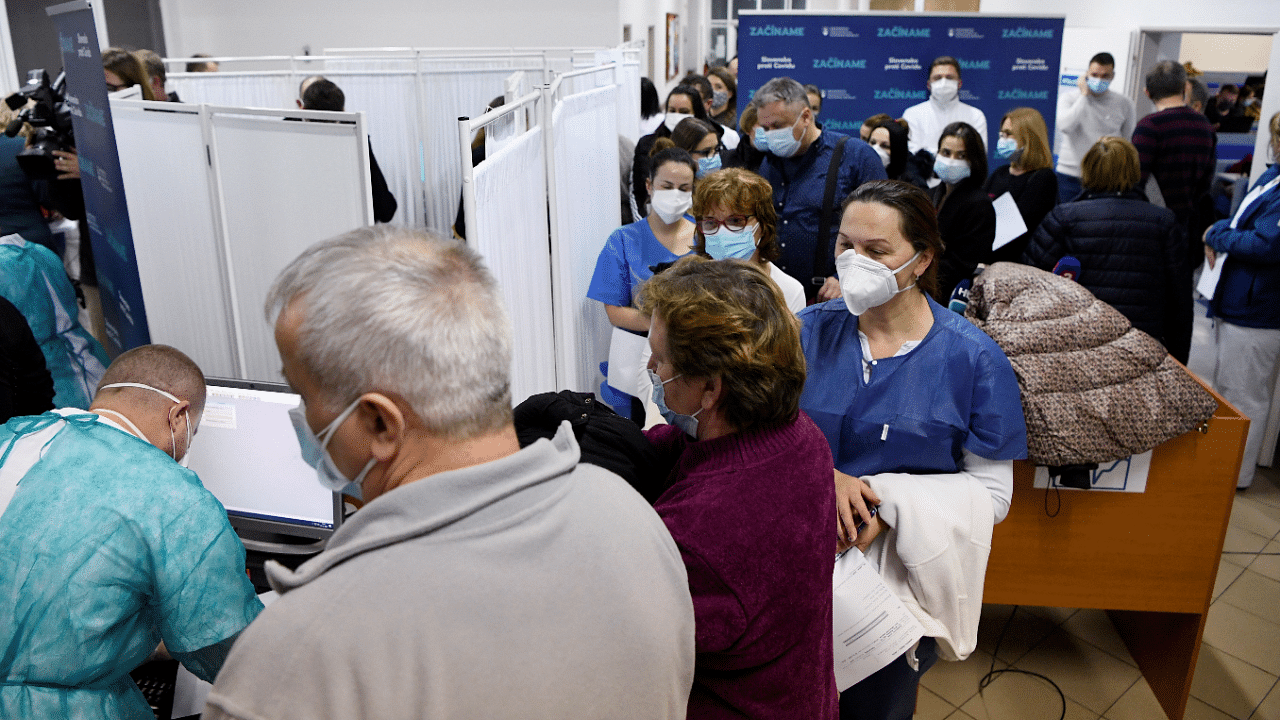 Healthcare workers wait to receive an injection with a dose of Pfizer-BioNTech Covid-19 vaccine at the University Hospital. Credit: Reuters Photo