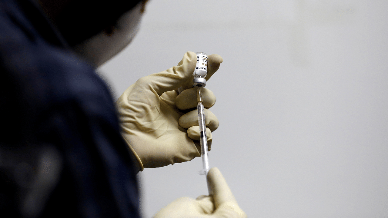 A medic fills a syringe with Covaxin. Credit: Reuters Photo