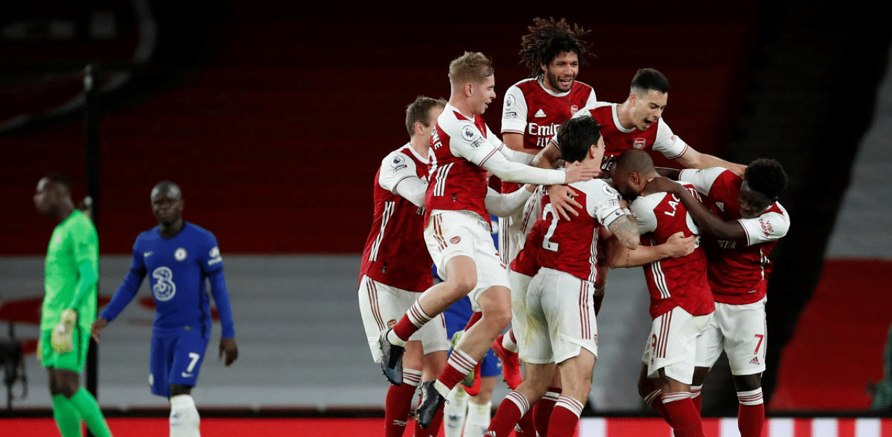 Arsenal's Granit Xhaka celebrates with his teammates after scoring their second goal in a stunning 3-1 win over Chelsea at the Emirates Stadium in London. Credit: Reuters