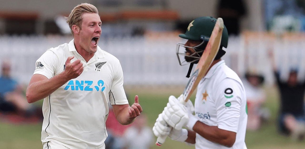 New Zealand’s paceman Kyle Jamieson (L) celebrates the wicket of Pakistan’s Shan Masood (R) during the second day of the first cricket Test match between New Zealand and Pakistan at the Bay Oval in Mount Maunganui. Credit: AFP