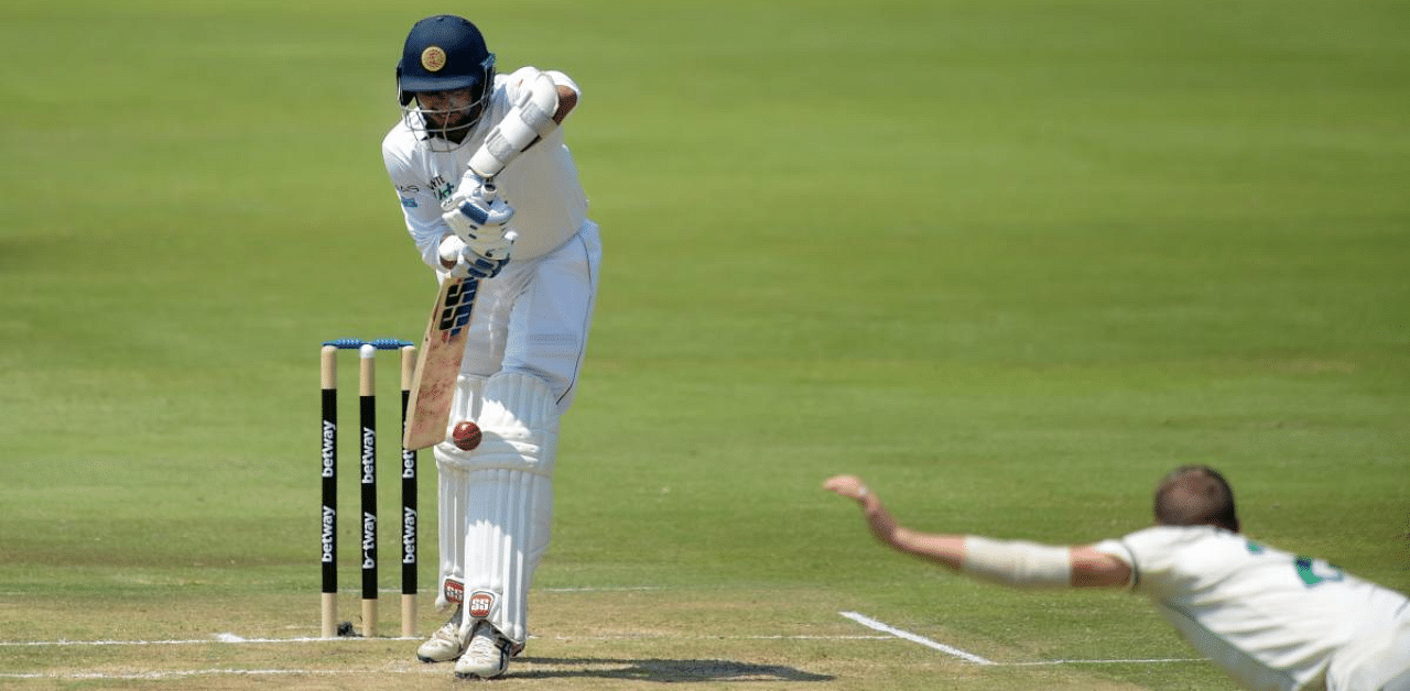 Dasun Shanaka (L) plays a defensive shot from a delivery by South Africa's Anrich Nortje during the second day of the first Test cricket match between South Africa and Sri Lanka at SuperSport Park in Centurion. Credit: AFP Photo